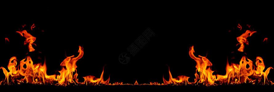 在黑色背景的火焰中燃烧红色热火花升起橙发光的飞行颗粒美丽质地力量图片
