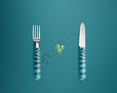 蓝底带刀和叉子的绿豆环境陶瓷烹饪图片