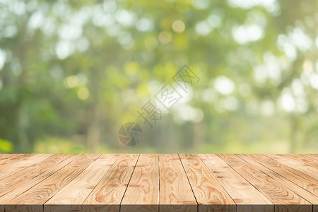 夏天模糊背景复制空间上的木板用于对您的产品或设计进行匹配抽象背景模糊的棕色板面散景木头背景图片
