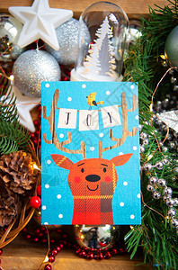 圣诞背景带有鹿的美丽卡片欢乐题词圣诞节背景欢乐题词棕色的美丽祝贺图片