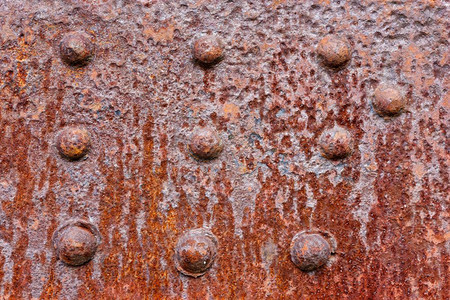 具有诱动接合的生锈金属壁表面工业抽象体旧刺动金属墙面腐蚀古董优质的图片