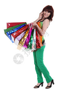 模型裙子纸女手持白种孤立的彩色购物袋手持花样多彩的购物袋图片