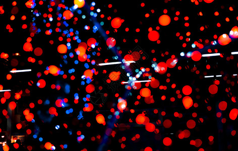 圣诞快乐新年盛装红蓝和橙色彩布谷背景美丽模式在派对圣诞节晚宴的夜里突出Xmas光在圣诞庆典上祝黑暗的蓝色图片