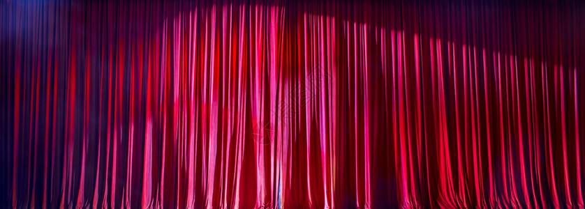 剧院红色窗帘全景灯光照亮一幕黑色的百老汇图片