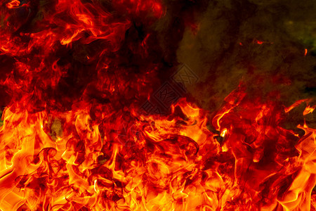 点燃抽象艺术黑色背景的火焰燃烧红色热火花上升烈橙光闪耀的飞行粒子壁炉炽盛图片