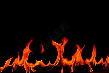 力量抽象艺术黑色背景的火焰燃烧红色热火花上升烈橙光闪耀的飞行粒子壁炉质地图片