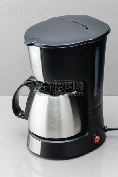 健康混合磨灰镜背景带不锈钢咖啡壶的电动机灰镜背景带壶的咖啡机图片