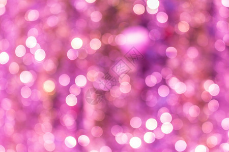 粉红色抽象闪光散焦景灯用于背模糊颜色庆祝图片