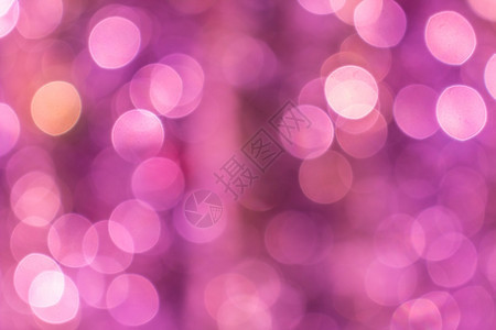 辉光圆形的派对粉红色抽象闪光散焦景灯用于背图片