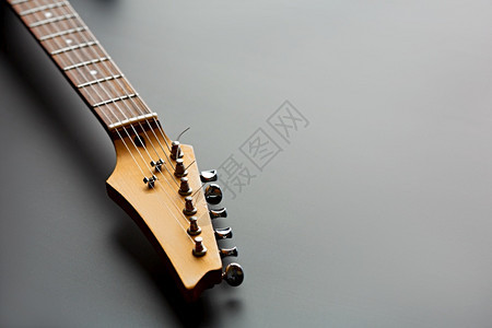 木头歌曲黑色的电吉他对弦乐器头部的特视电声子音乐舞台会设备电吉他头部特观图片