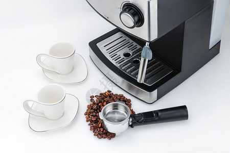 白色的意式浓缩咖啡机白色背景上带有蒸汽喷射装置带有复印空间白色背景上带有复印空间的意式浓缩咖啡机豆电气图片