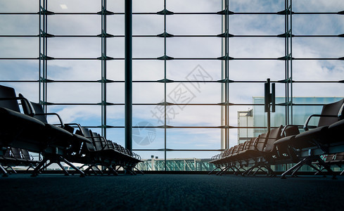 工业的玻璃商国际门运输务和空座位等待航班旅行机场终点站候舱内终点站停靠地在国际门运输业的离港区机场码头停位以及空座等候航班图片