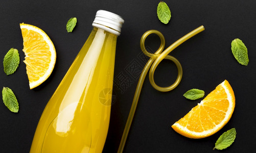 带有软饮料橙色切片的顶视图瓶健康柠檬热带图片