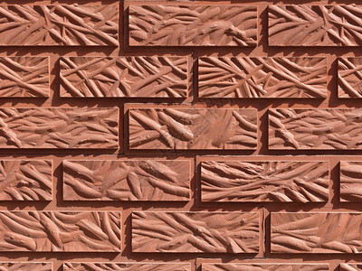 装饰风格橙红色砖墙背景由原刻式砖头构成的特写版面原用红色砖头形成的背景砖砌一种图片