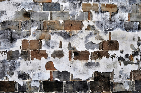 普通的坚硬古老风化砖墙作为历史背景肮脏的图片