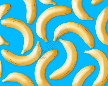 蓝色香蕉茶点健康蓝色背景的无缝新鲜香蕉气泡设计图片