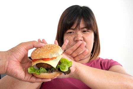 糖节食亚洲肥胖健康的女拒绝吃汉堡保健和营养食品的概念健康和营养食品的概念不良图片