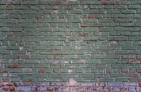 质地基辅乌克兰绿色和红砖墙背景的铁板工业壁绿色和红砖墙粗糙的结石图片