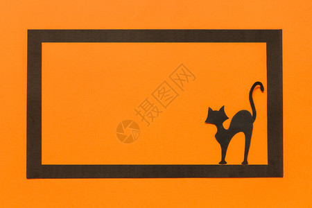 最佳快乐万圣节概念文字空间TopViewMockup布局平坦的版面铺万圣节背景黑色纸猫橙背景上的黑纸猫落下色的图片