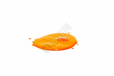 颜色复制橙水滴喷洒在白背景上花图片