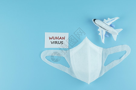 蓝背景的保护面罩和飞机模型对抗新科罗纳2019nCOV或冠状和防疫卫生和保健概念世界人类小说图片