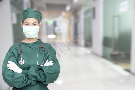 健康具有听诊器的亚洲女外科医生在院诊所戴面罩以对抗CoronaCovid19诊断分析住院病人临床治疗用于理论实验室研究案例理论上图片