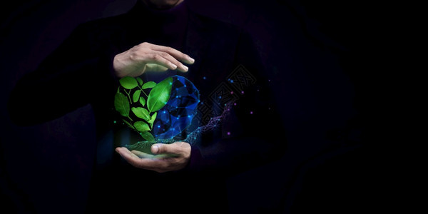 ESG概念自然将技术绿色叶子作为形状由神之手保护的绿色能源可再生和持续资源环境和生态关怀所保护的绿色树叶公司漂浮可持续背景图片