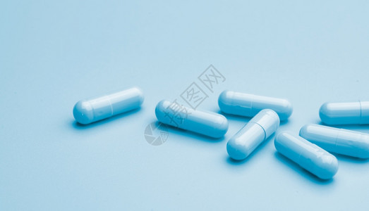 抗生素新的蓝色背景上胶囊丸在线药房横幅胶囊丸组制药业治疗新兴传染病的药物开发和新研究片剂图片
