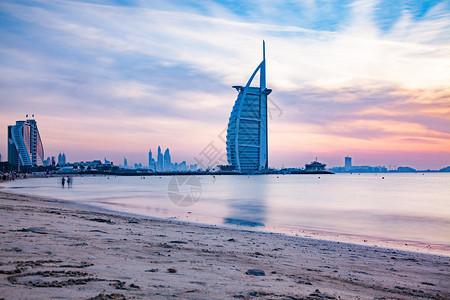 城市景观旅行在阿拉伯联合酋长国迪拜Jumeirah公共海滩上晚见识到七星豪华旅店BurjAlArrab头七星级酒店景观图片