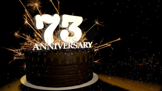 木制的热周年纪念73卡圆形巧克力蛋糕装饰着蓝色红黄绿的糖衣杏仁木桌上有白色数字背景是人造火星和彩色糖衣丸落在桌子上3D插图周年纪图片