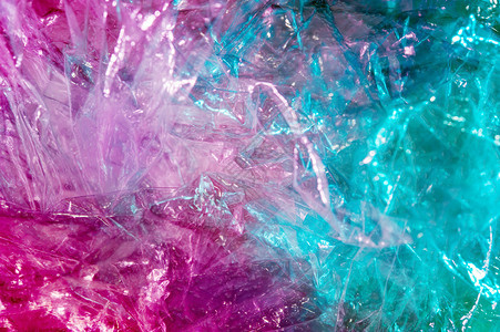 虹彩809年代风格的抽象时尚全息背景亮酸色皱褶玻璃纸薄膜的真实质感SynthwaveVaporwavewebpunk大众现实主义图片