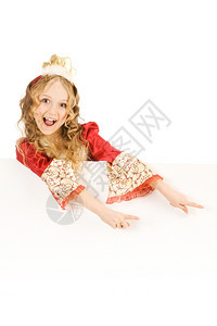 美丽的笑小女孩长着金头发的美丽女孩穿着公主服装展示标志种族幻想戏服高清图片素材