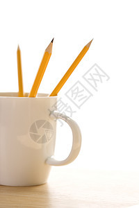 咖啡杯里的铅笔商业办公用品办公室杯子笔筒物体图片