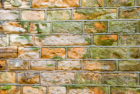 剪石墙橙子风化白色长方形矩形石工绿色灰色水泥砂浆图片