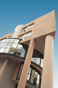 粉粉大楼城市窗户天空反射全球建筑学财产组织玻璃总部背景图片