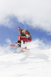 青少年滑雪滑雪冻结蓝色青少年季节山脉速度单板空气衣服木板背景