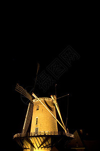 夜间风车建筑学刀片黄色农业黑色建筑背景图片