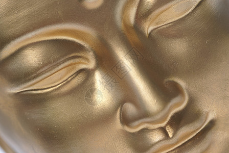 一张金色的脸宗教眼睛文化雕像精神智慧上帝对角线宏观金子背景图片