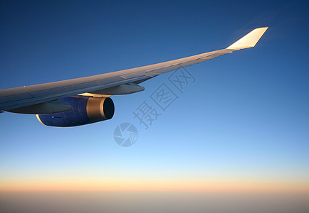 连翼太阳蓝色旅游航班运输天空库存日落白色商业图片