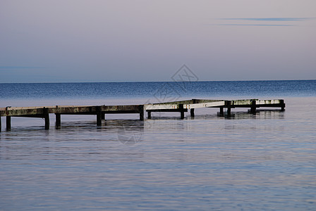 Falsterbo海滩日落黑色海浪天空橙子蓝色太阳图片