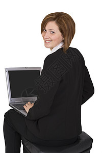 拥有膝上型电脑的女商务人士微笑互联网套装青年伙伴人士商业蒲团展示屏幕背景图片