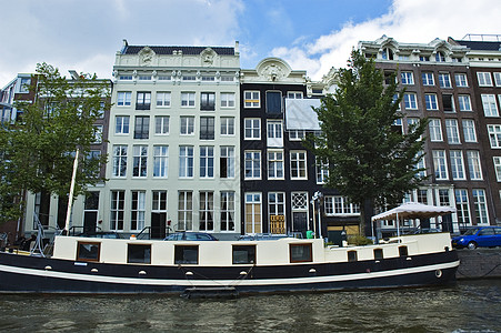 阿姆斯特丹红灯区阿姆斯特丹的房屋三桅房子帆船驳船运河建筑背景