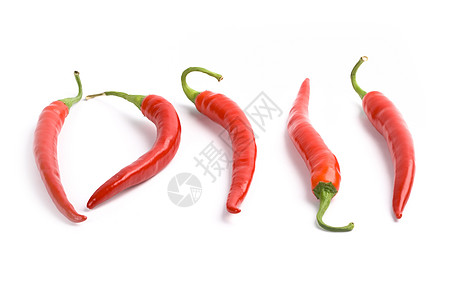 5个红辣椒红色绿色食物香料白色蔬菜宏观辣椒活力水果图片