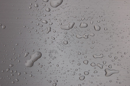 金属表面的水滴汽车飞沫飞溅火花气泡宏观雨水墙纸下雨合金背景图片