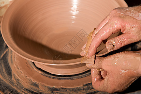 Potter 雕塑克莱工匠陶器地球黏土艺术家工艺投掷工具艺术旋转图片