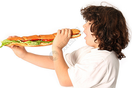 男孩吃大三明治午餐童年饮食早餐食物学校头发情绪白色享受图片
