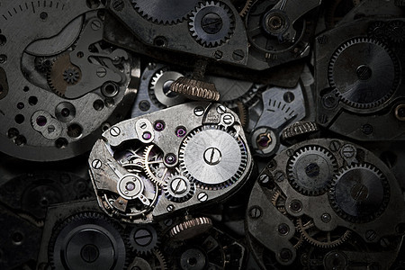 时钟工作宏观齿轮机器时间金属装置发条手表背景图片