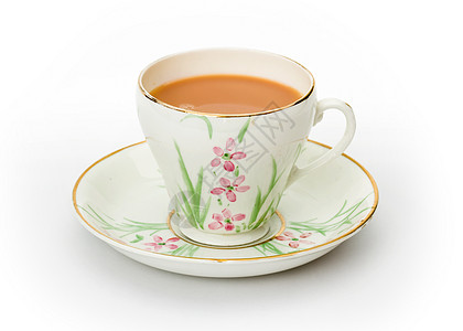 茶在手工涂漆的杯子和酱汁里图片