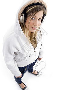 用耳机播放音乐的年轻青年模范女性旋律白色女士乐趣技术姿势冒充魅力工作室图片