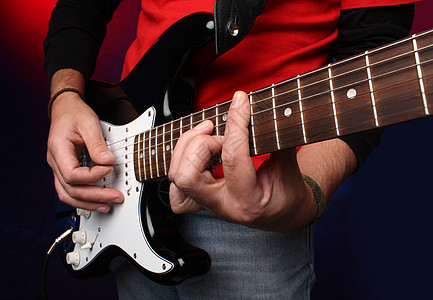玩电吉他娱乐乐器细绳音乐家吉他手指板流行音乐岩石音乐红色图片